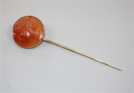 An early 20th century yellow metal and carnelian cameo set stick pin.